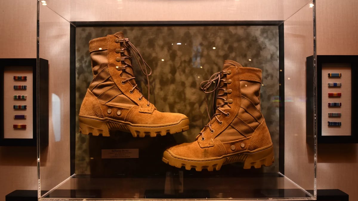 Deshauna Barbers boots on display in new Heroes Tribute Bar onboard Carnival Legend