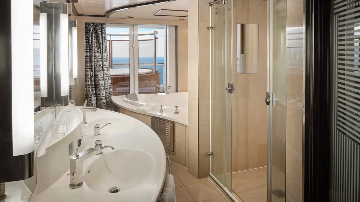 Pride of America - Deluxe Owner's Suite with Large Balcony Master Bedroom