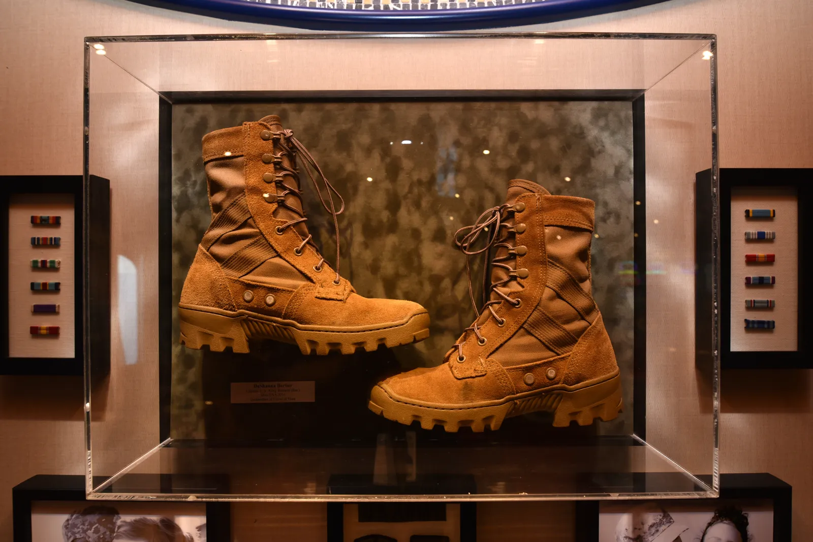 Deshauna Barbers boots on display in new Heroes Tribute Bar onboard Carnival Legend